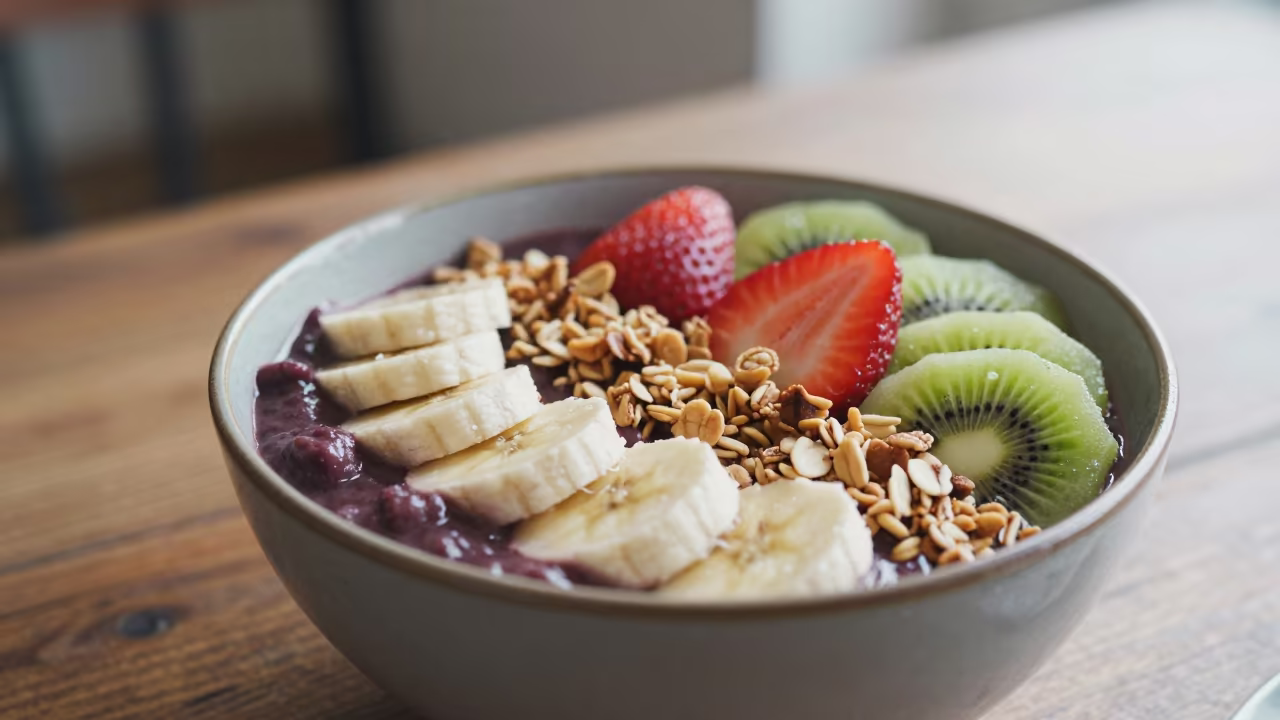 Açaí Bowl With Fresh Fruit On Wood Table in on a rustic wooden table in Dhanmondi, Dhaka