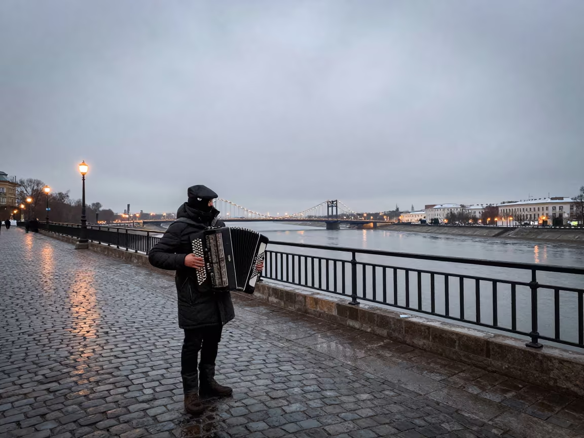 Accordion Player on Minsk Bridge at Dusk in beside a canal in Minsk