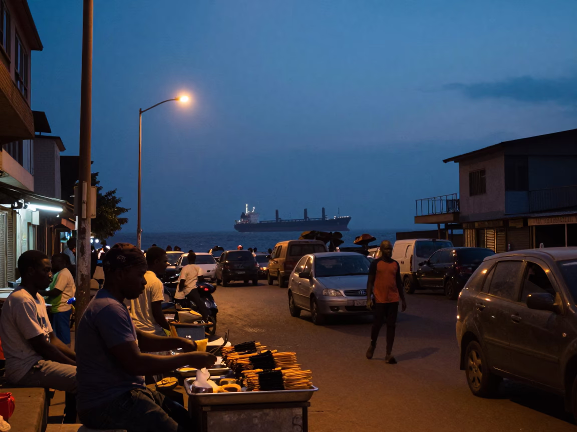Accra Ghana Predawn Street Scene with Cargo Ship Horizon and Local Market Activity in in Accra, Ghana