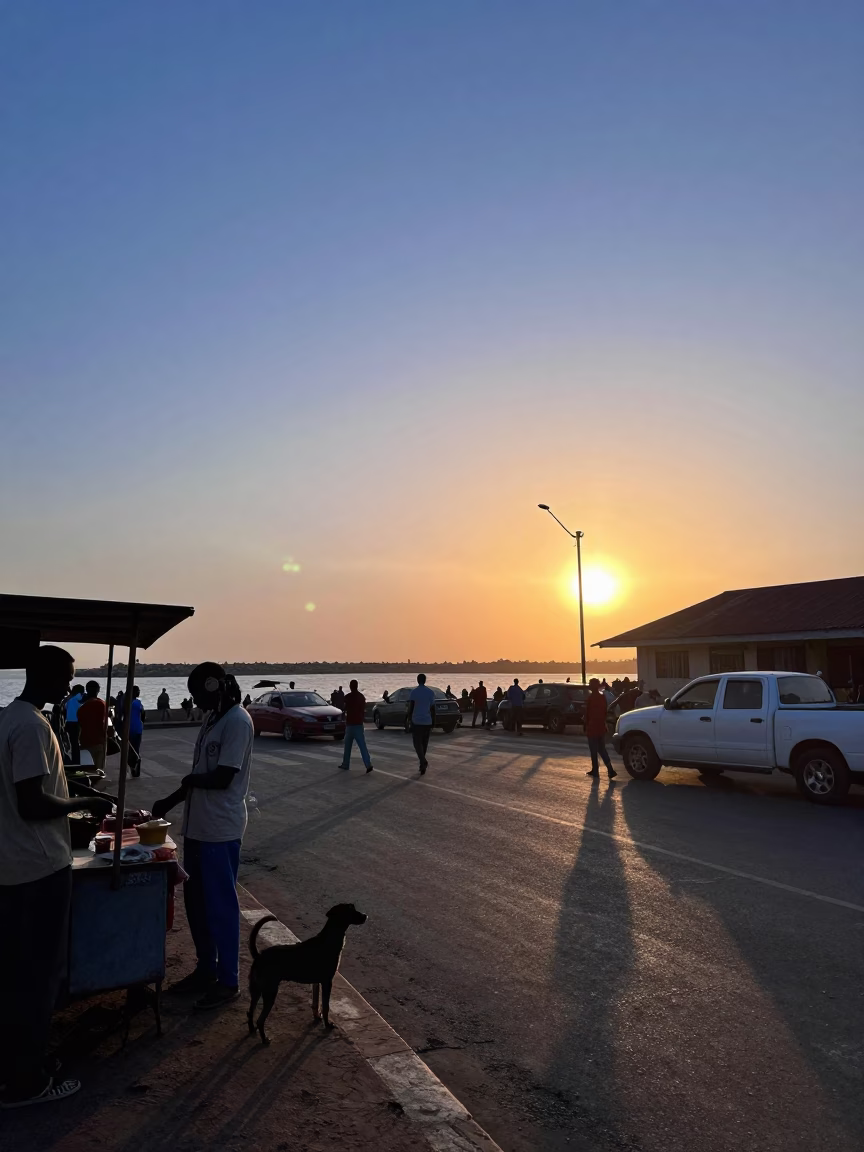 Accra Ghana street scene at sunset with blue hour sky and harbor breakwater in in Accra, Ghana