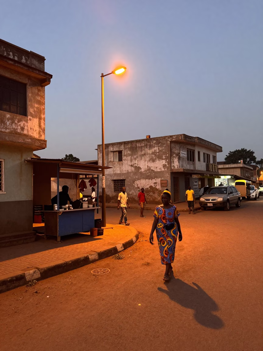 Accra Ghana Street Scene Copper Light Before Dusk with Local Market Activity in in Accra, Ghana
