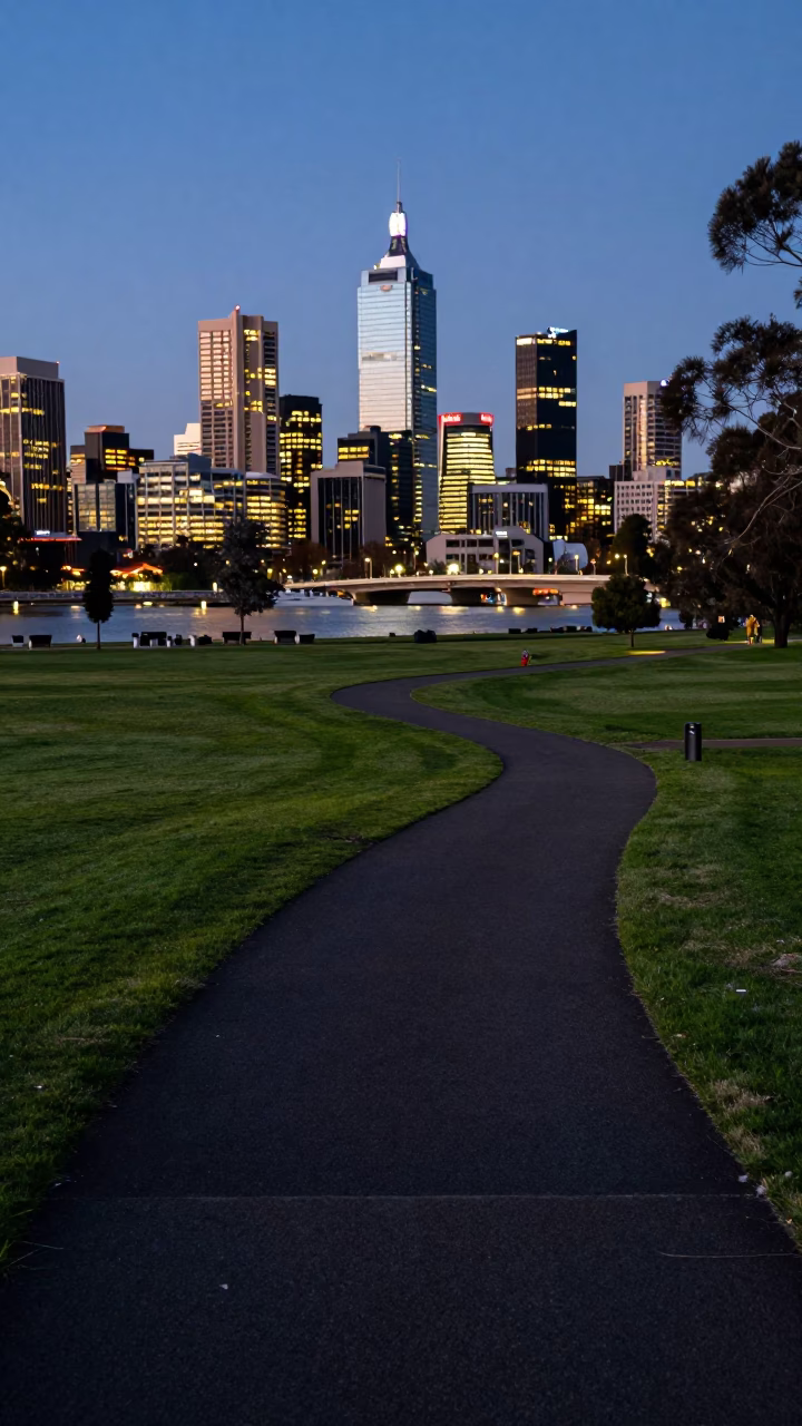 Adelaide City Lights Glow Over Riverbank Parkland Evening Scene in in Adelaide, South Australia, Australia