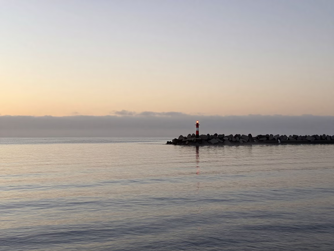 Adelaide nautical dawn harbor scene with breakwater beacon and casual morning visitors in in Adelaide, South Australia, Australia