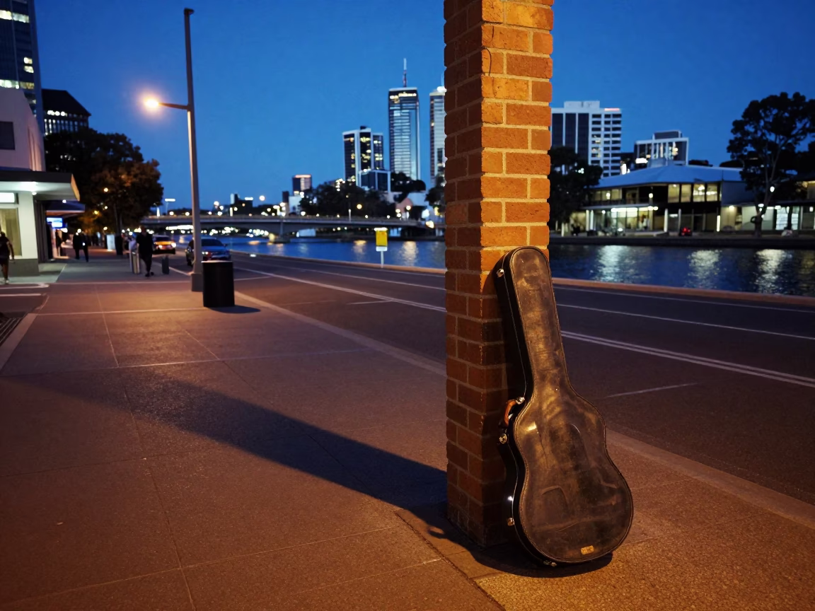 Adelaide South Australia indigo twilight street scene with vintage guitar case and city lights in in Adelaide, South Australia, Australia