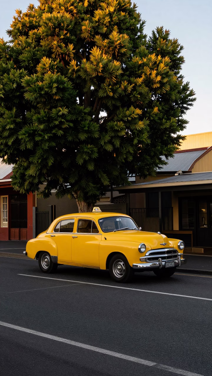 Adelaide South Australia Sunset Street Scene with Vintage Yellow Taxi and Terraced Gardens in in Adelaide, South Australia, Australia