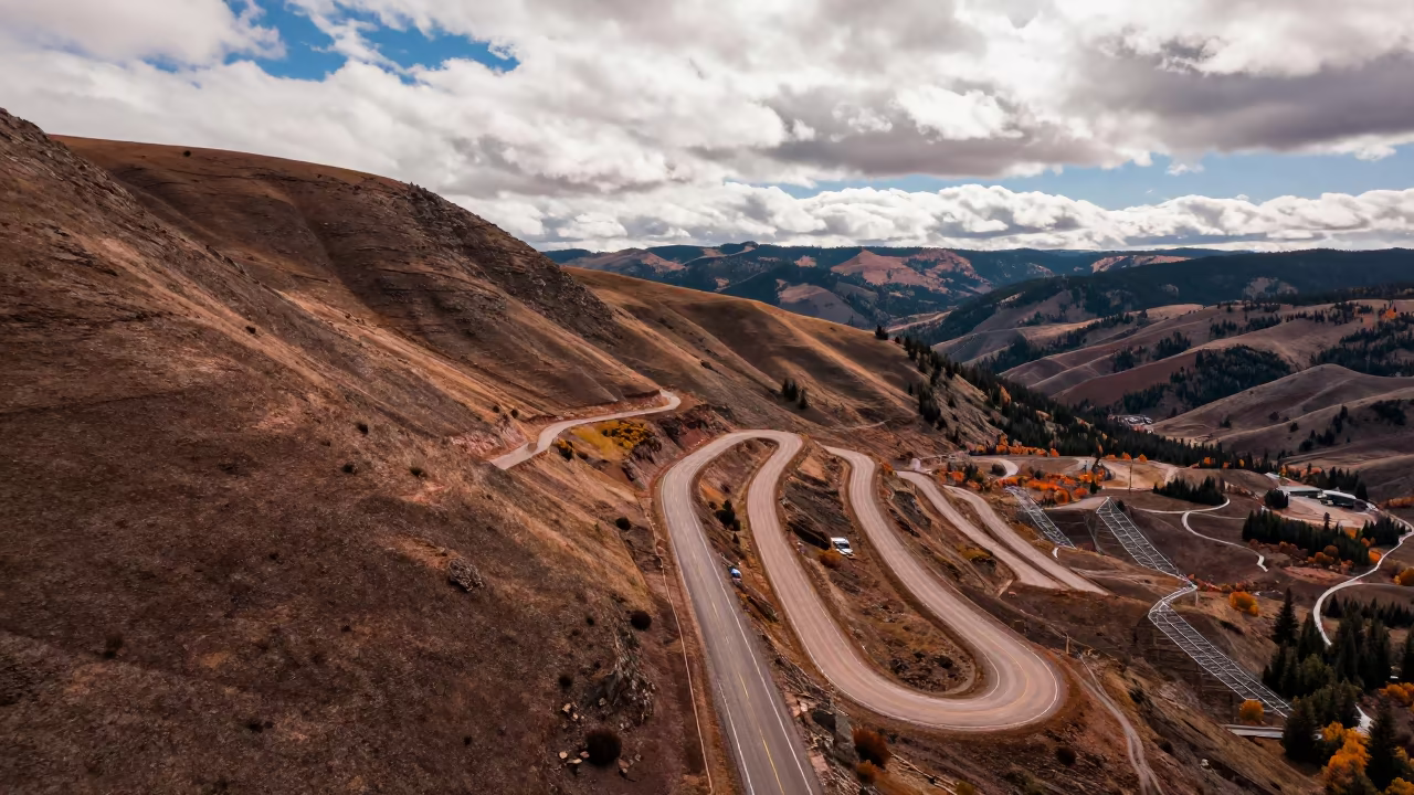 Aerial View of Colorado Switchback Road in Copper Light in high above irrigation geometry in Colorado