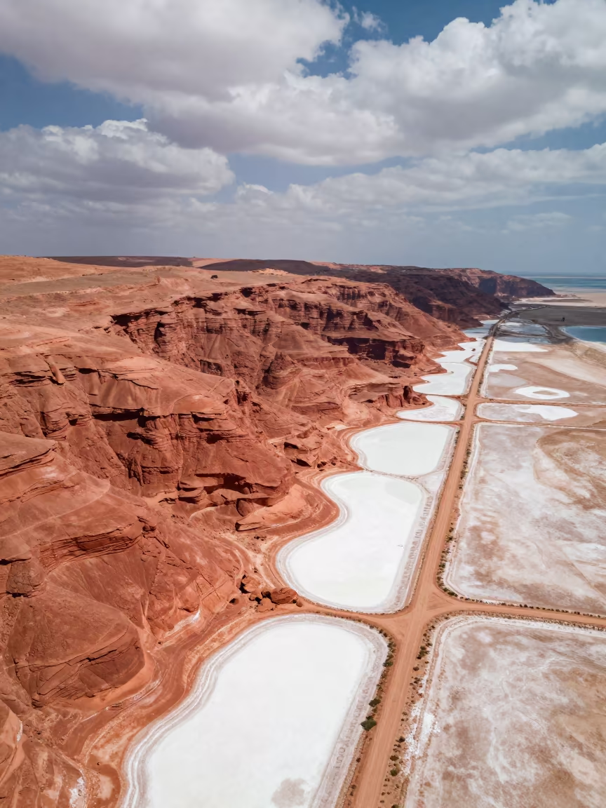 Aerial Desert Canyon Red Walls Salt Ponds Cairo in high over salt ponds and causeways near Garden City, Cairo