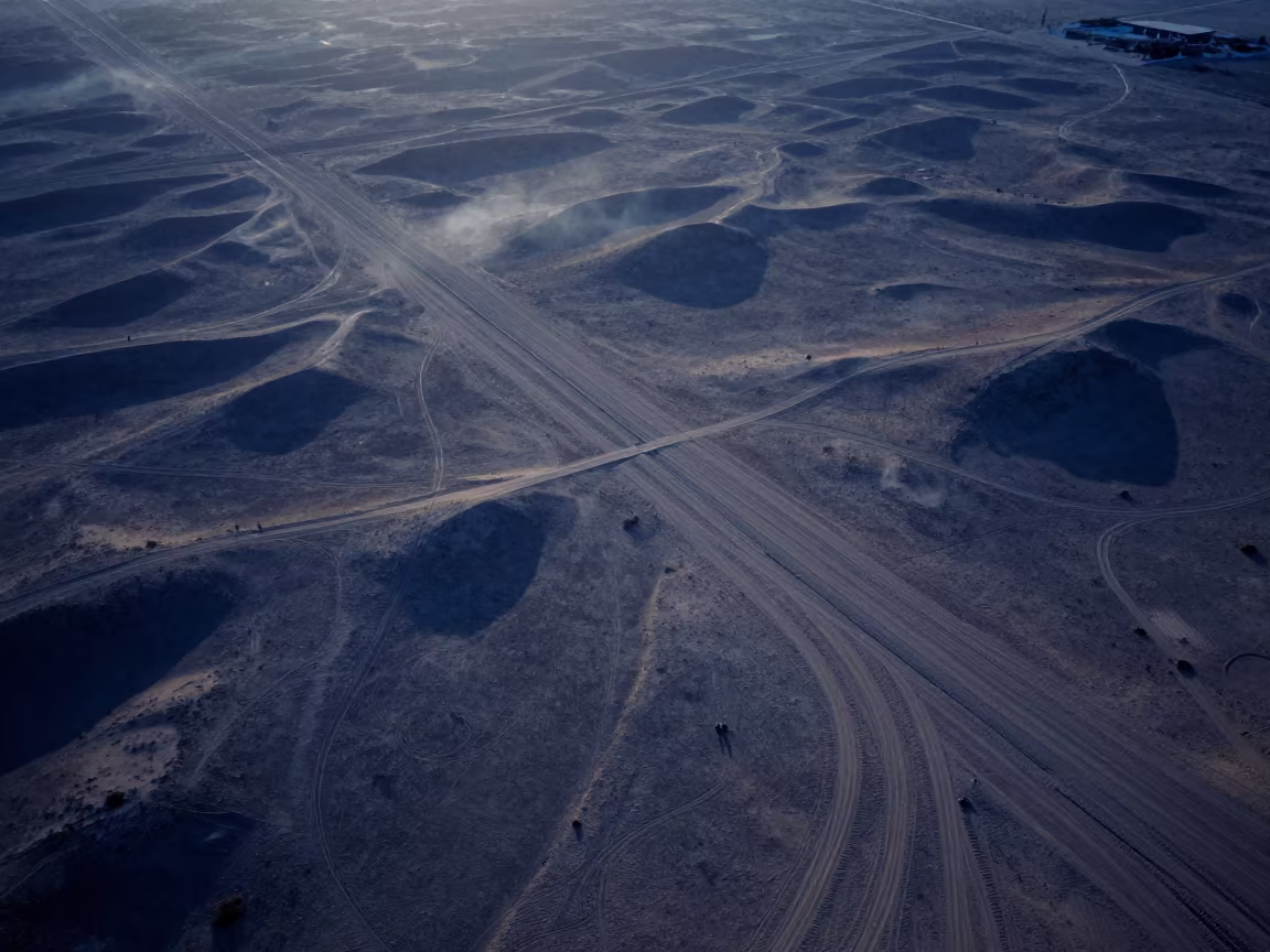 Aerial Desert Tracks Evening Shadows Saudi Arabia in high above irrigation geometry in Saudi Arabia