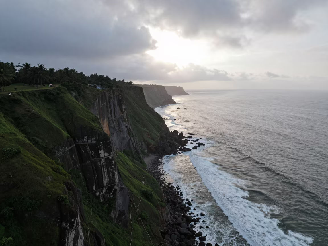 Aerial Kerala Cliffs Dawn Rain Surf in far above surf-scalloped coastline in Kerala