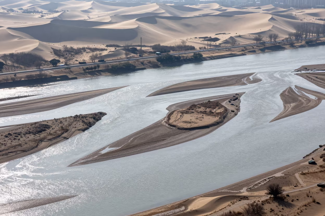 Aerial River Islands Braided Through Silver Floodwater in above dune fields and dry wadis near Taichung