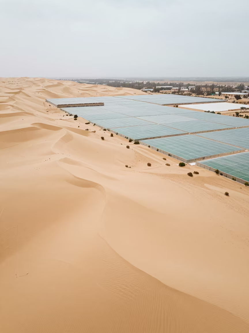 Aerial Sand Dunes Over Libyan Greenhouse Grids in high over greenhouse grids in Libya