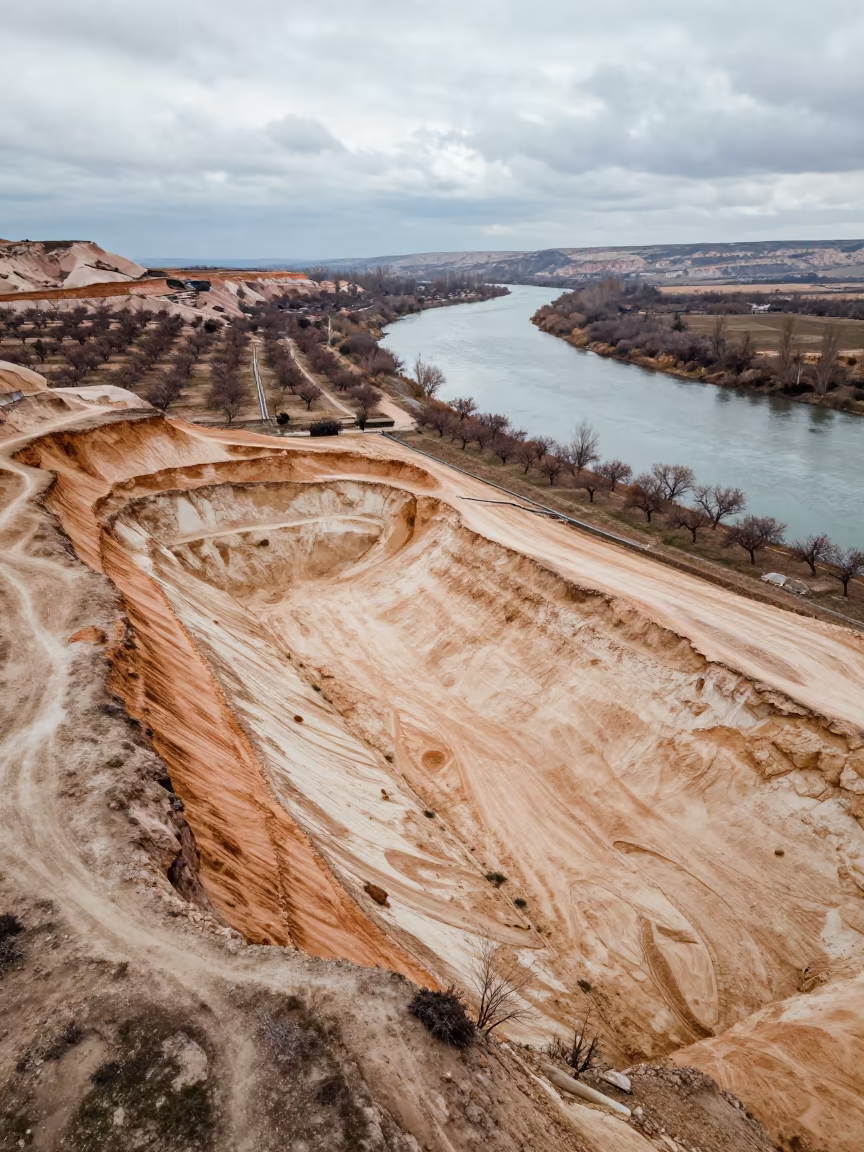 Aerial Sand Pit Winter Cappadocia River in far above orchard blocks and irrigation lines in Cappadocia