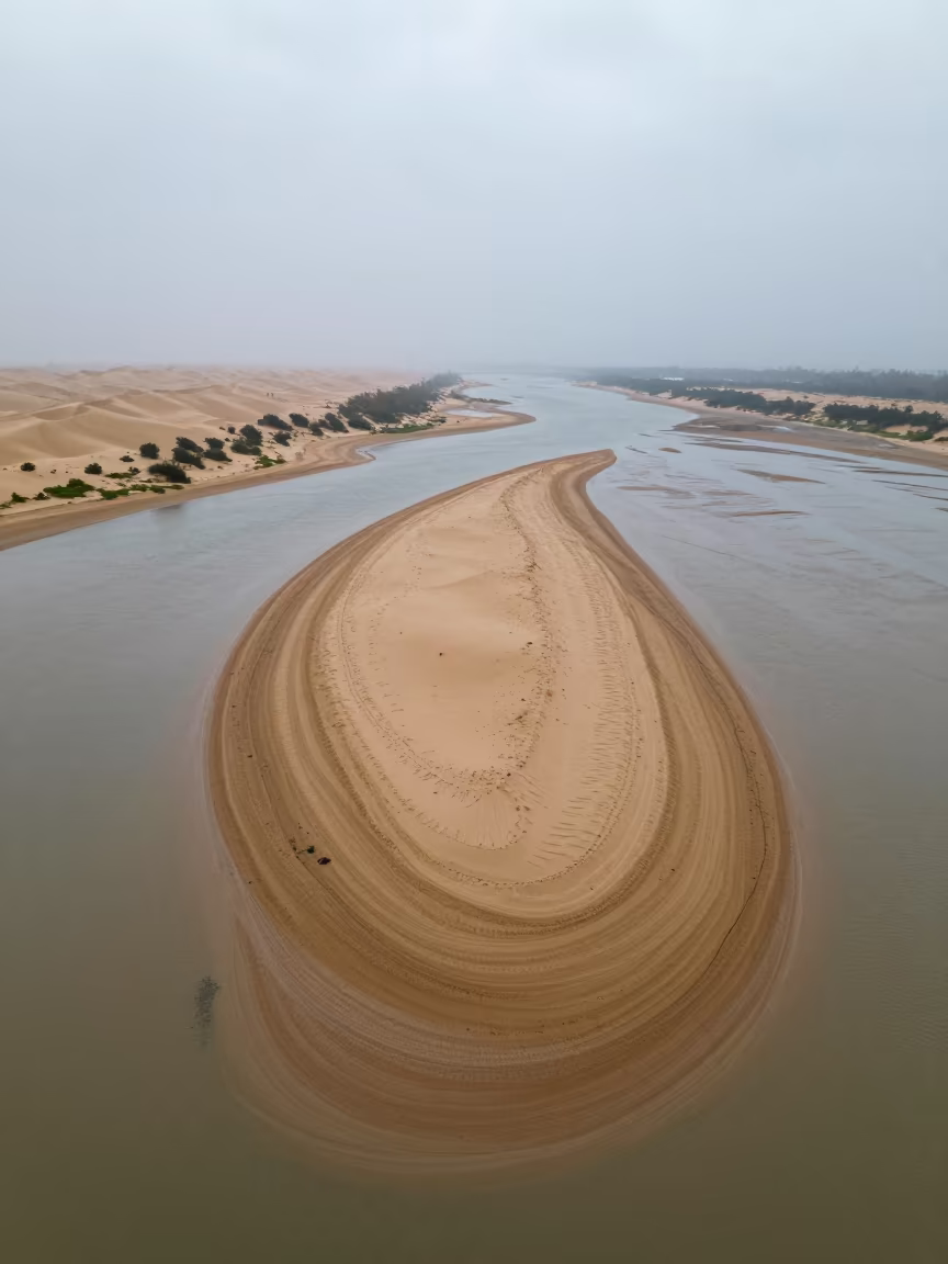 Aerial Sandbar Island at Low Tide Near Carrefour in above dune fields and dry wadis near Carrefour