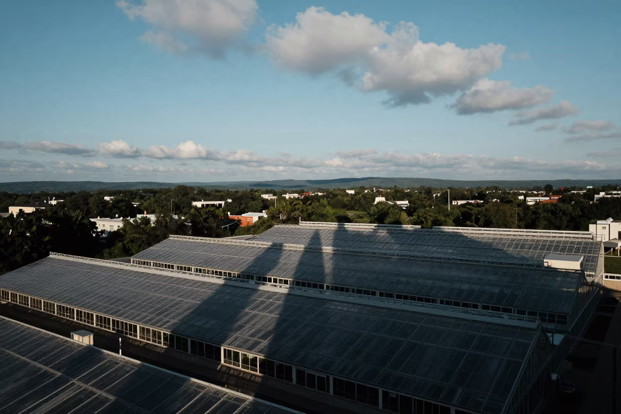 Aerial Skyscraper Shadows Over West Virginia Greenhouses in high over greenhouse grids in West Virginia