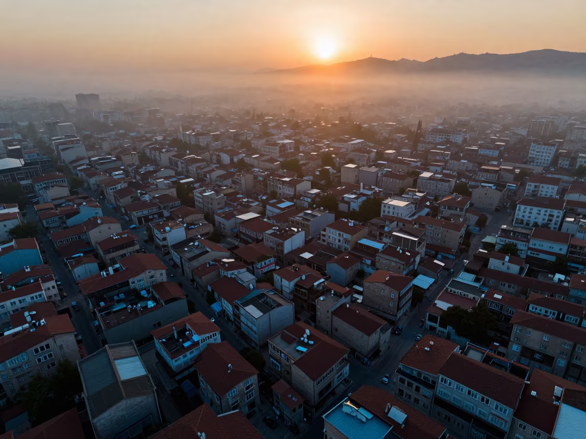 Aerial Sunset View Over Turkish Rooftops in Mist in high above patterned rooftops in Turkey