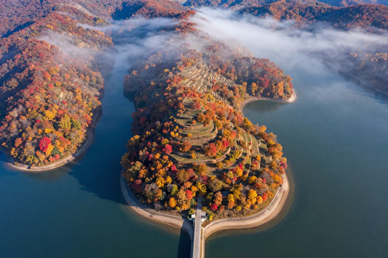 Aerial View of Tidal Island and Sand Causeway in Autumn in far above terraced hillsides in West Virginia