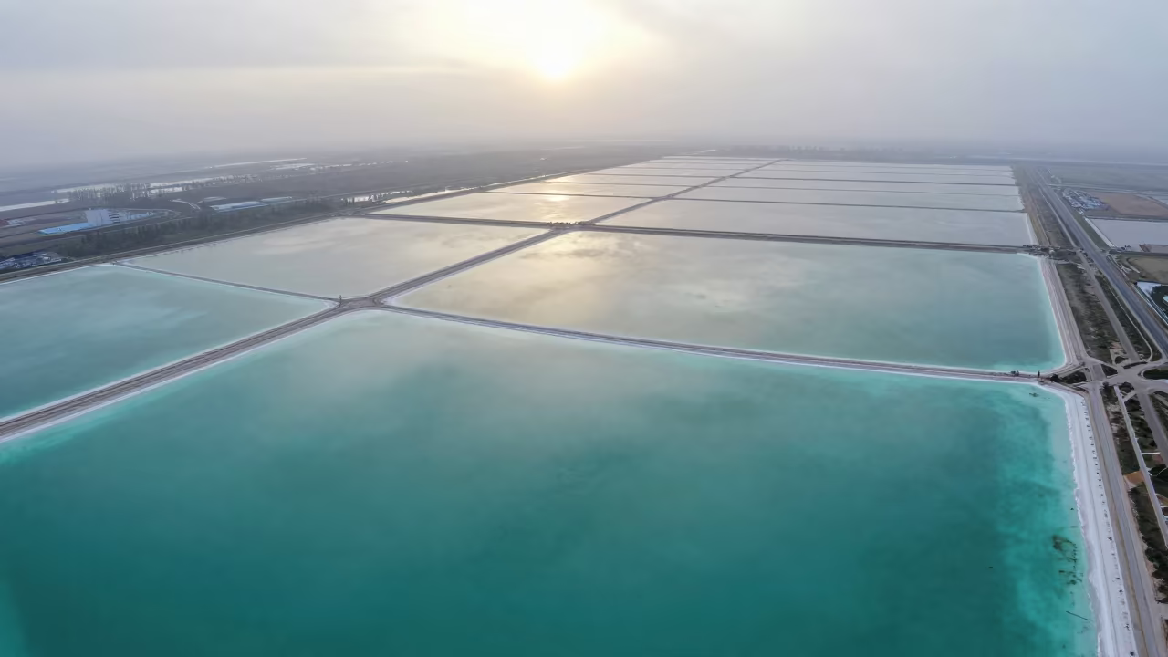 Aerial Turquoise Waves Over Salt Ponds in high over salt ponds and causeways near Astana