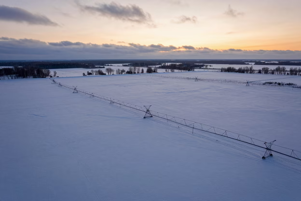 Aerial Winter Sunset Over Russian Irrigation Fields in high above irrigation geometry in Russia