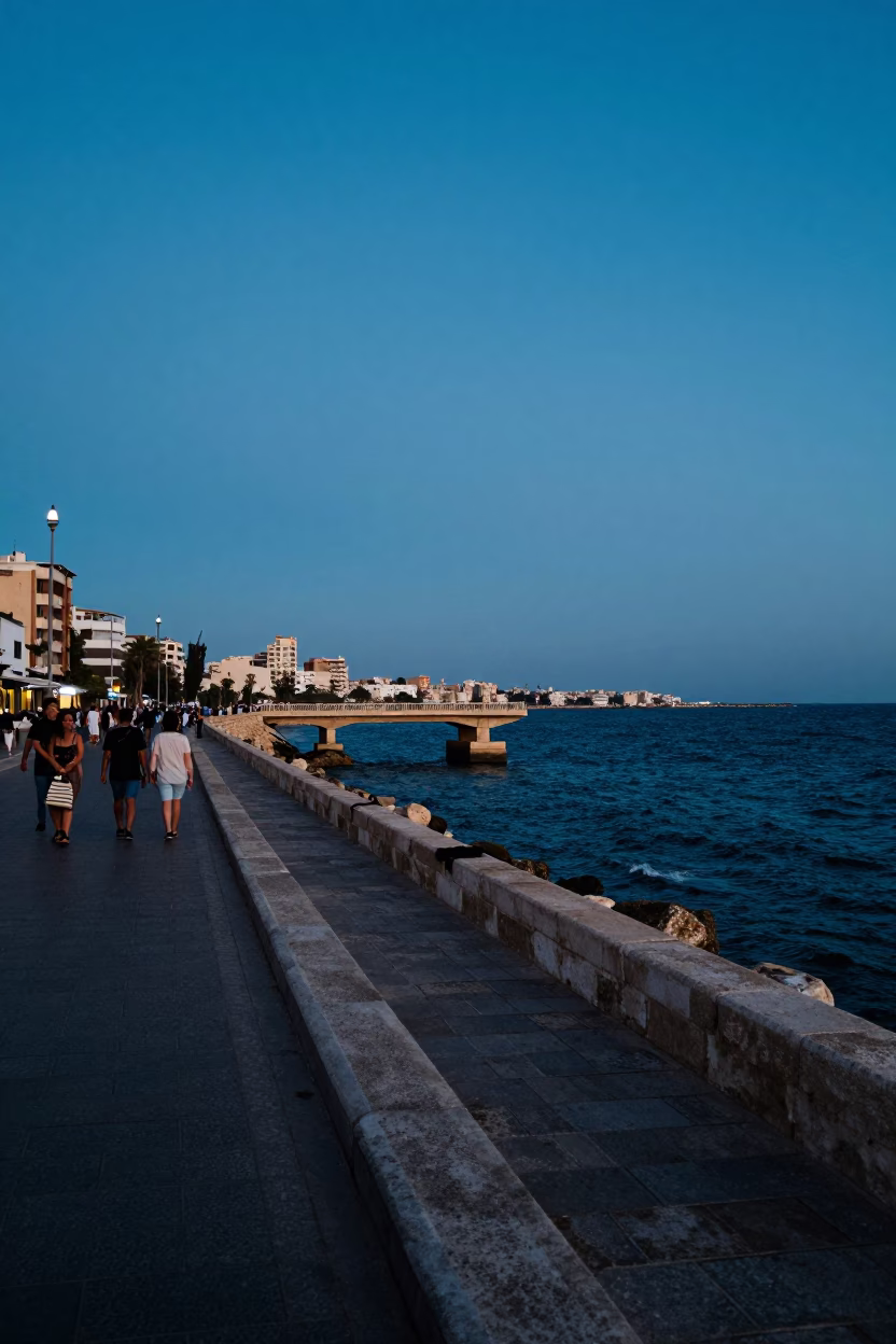 Alexandria Blue Hour Street Scene with Bridge Pier and Local Pedestrians in in Alexandria, Egypt