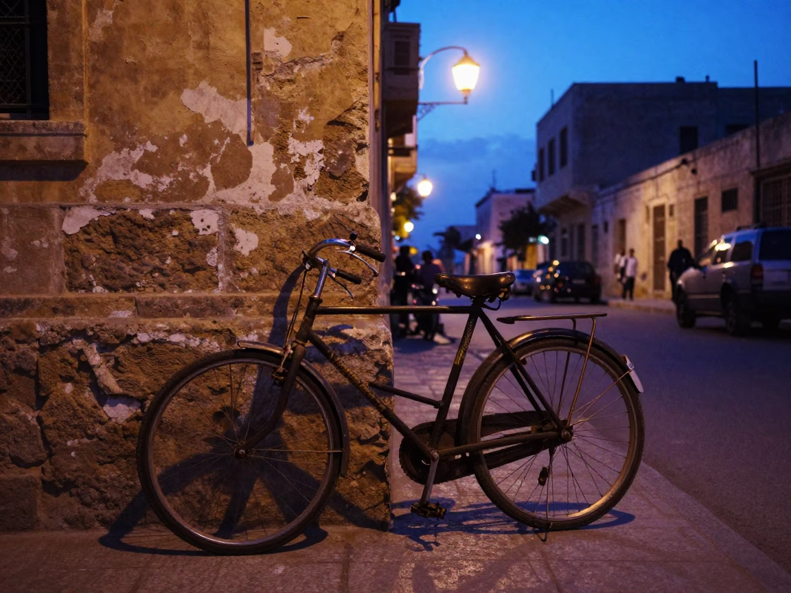Alexandria Egypt indigo twilight street scene with vintage bicycle and clipboard in in Alexandria, Egypt