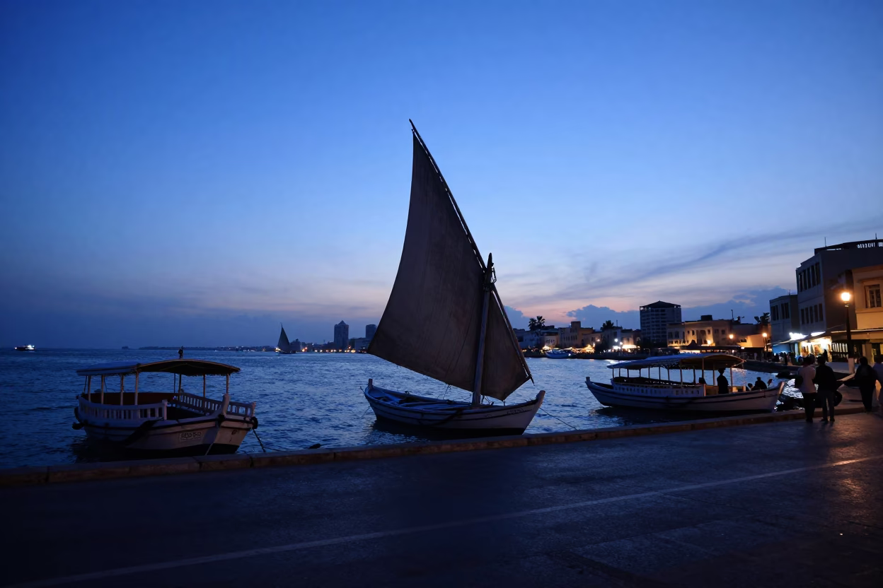 Alexandria Egypt pre-dawn street scene with vintage dhow and local commuters before sunrise in in Alexandria, Egypt