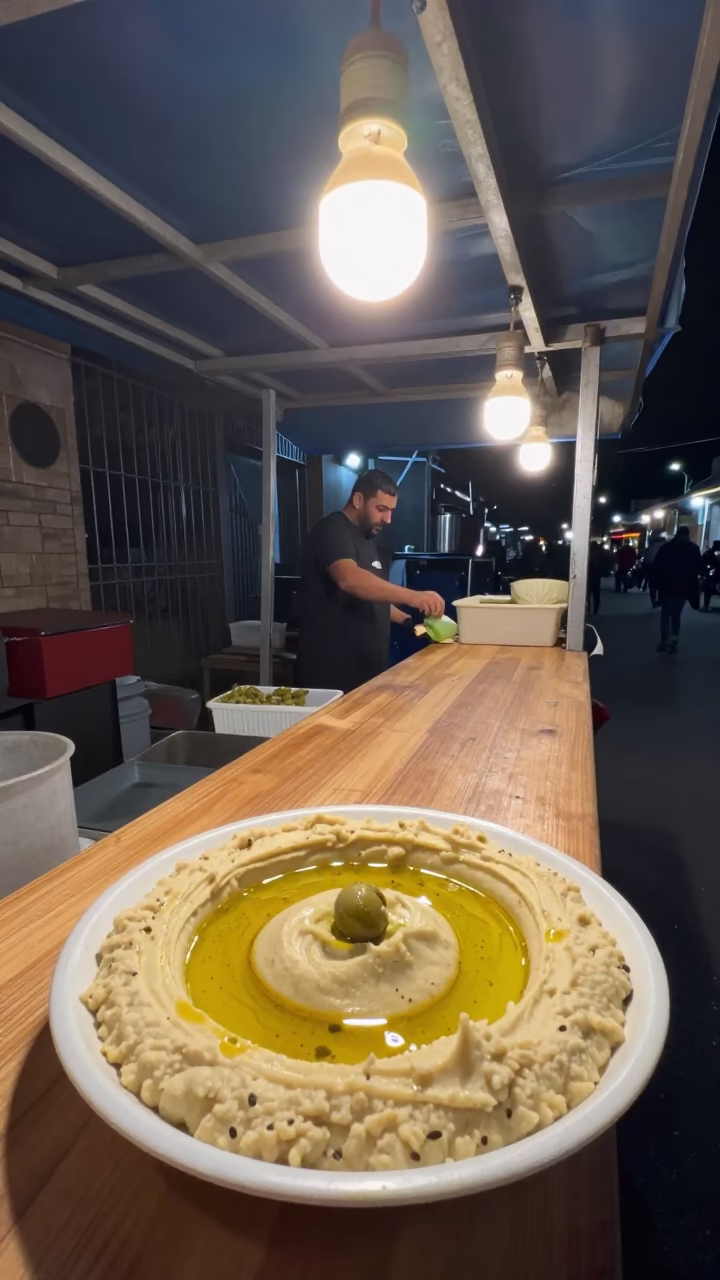 Alexandria Serving Hummus at Deep In The Night Light in in Alexandria, Egypt