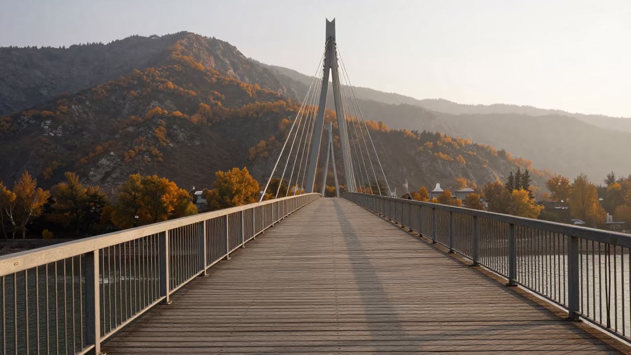 Almaty Drawbridge Dawn Steel Forms Haze in beside a bridge pier above moving water in Almaty