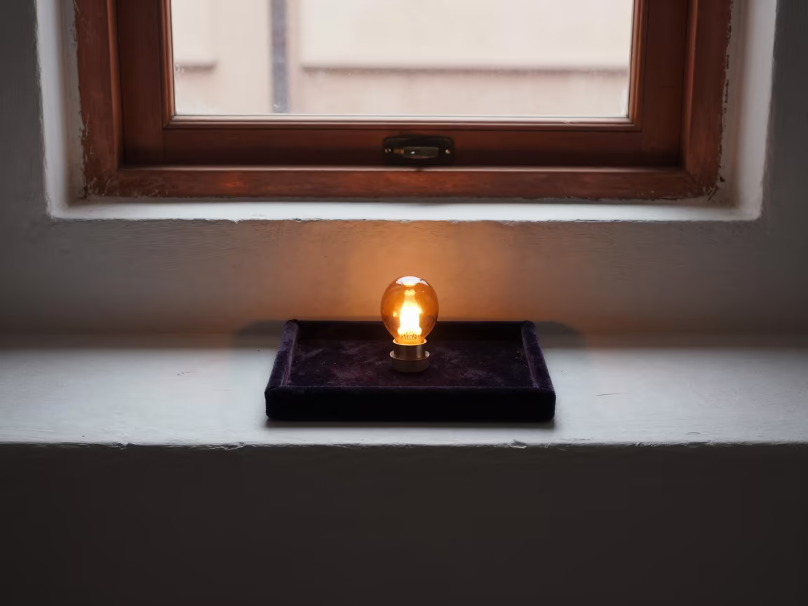 Amber Glow on Brooch in Idanre Jewel Tray in on a painted display ledge in Idanre