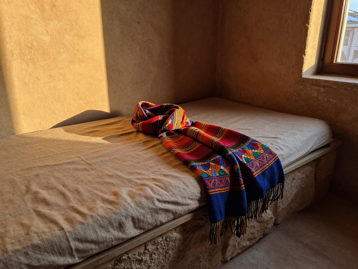 Amber Scarf on Linen Daybed Winter Sunset in on a stone ledge in Kahramanmaraş