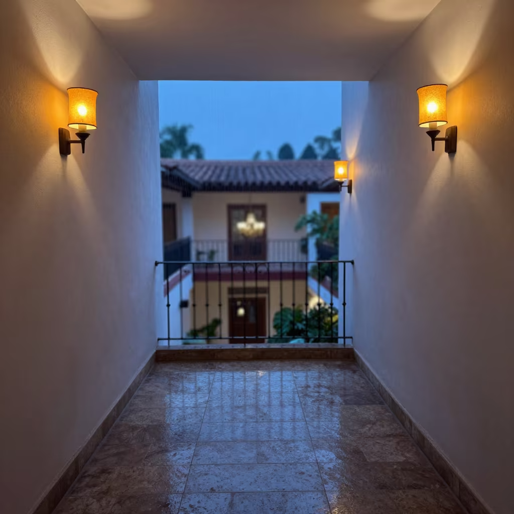 Amber Sconces on Hotel Stair Landing Twilight in inside a chandelier-lit hotel stairwell near Puerto Vallarta