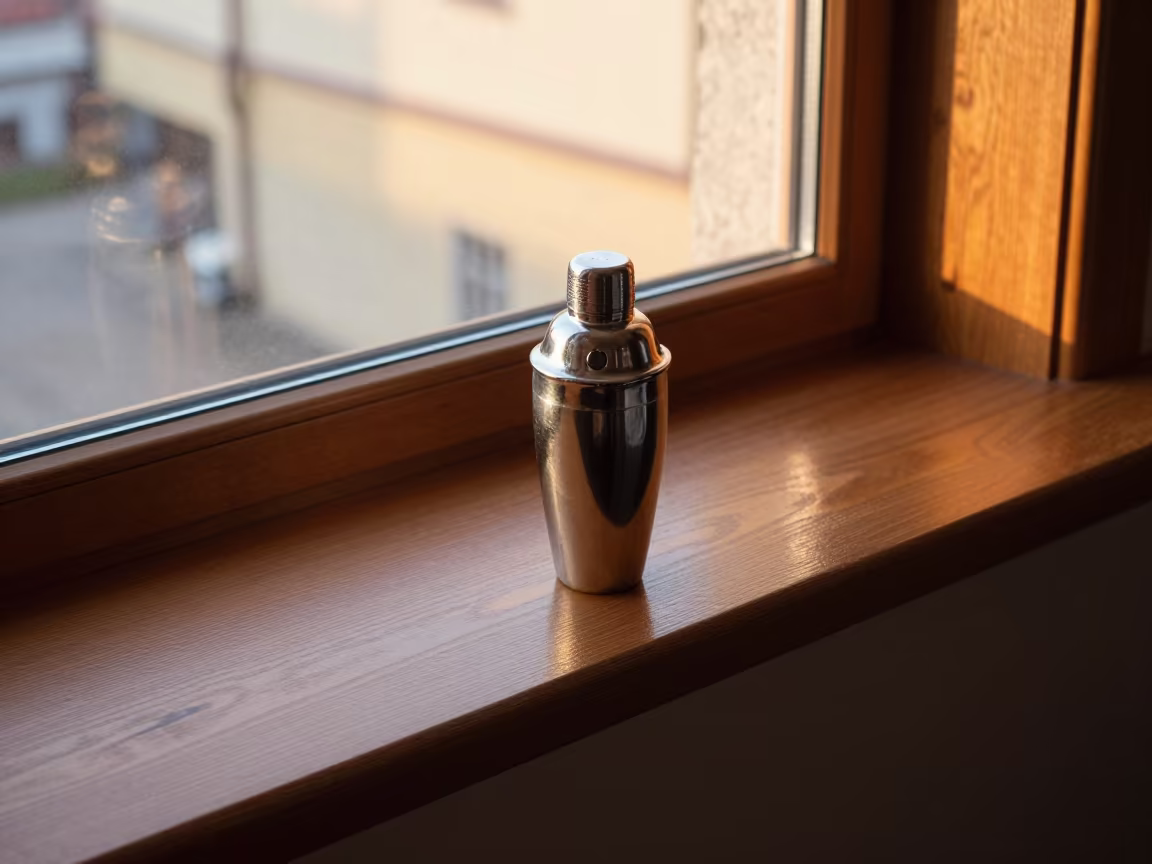 Amber Sunset Light on Cocktail Shaker in on a painted display ledge near Dąbrowa Górnicza