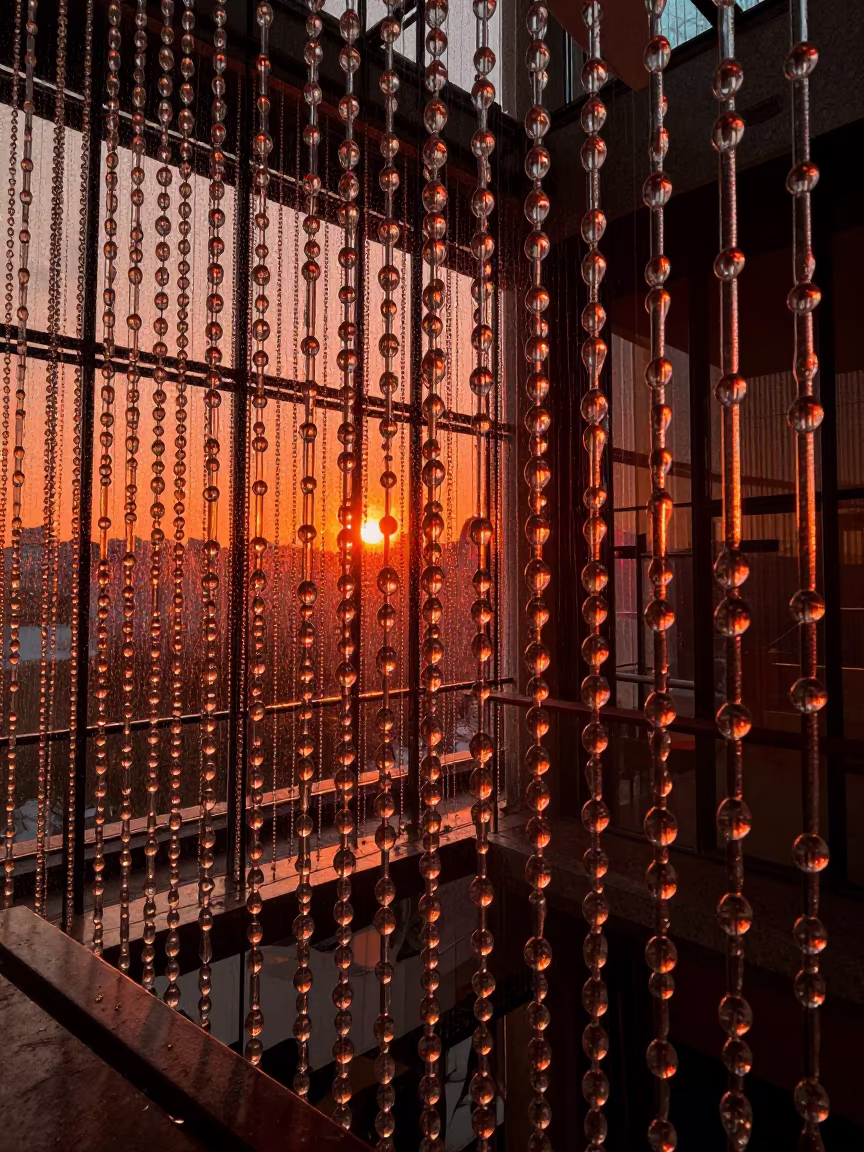 Amber Sunset Light Through Glass Bead Curtain in inside a vaulted atrium near Catia La Mar