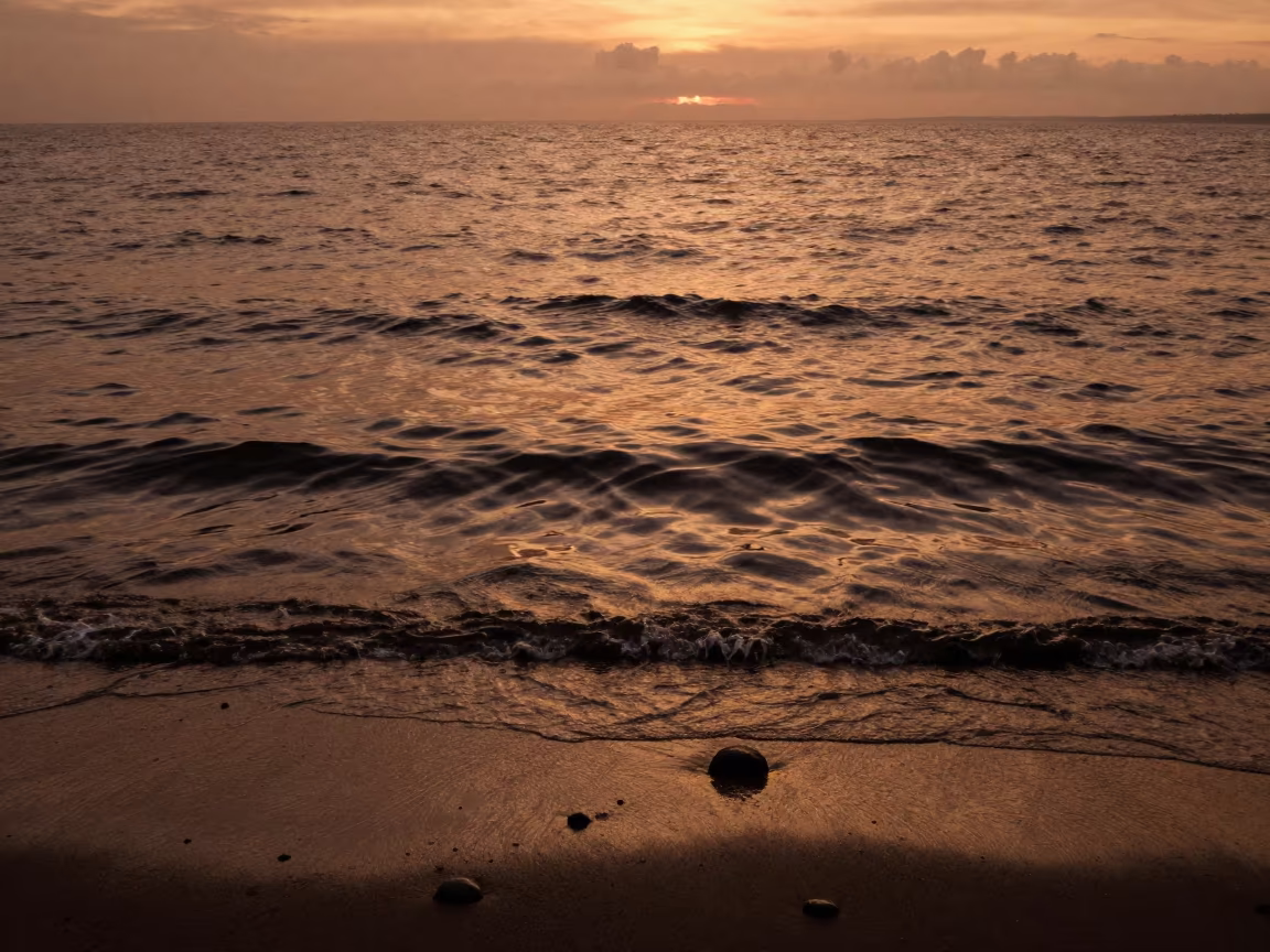 Amber Sunset Moire Waves on Sumatra Shore in along a wave-cut shoreline in Sumatra