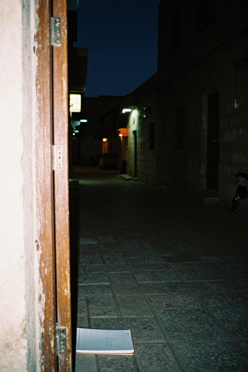 Amman Jordan Night Street Scene with Doorframe and Notebook Under Deep Sky in in Amman, Jordan