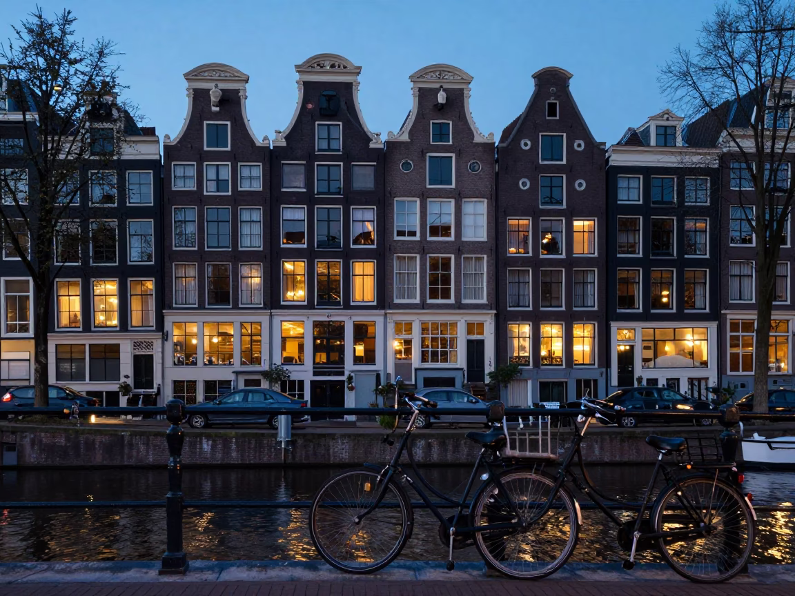 Amsterdam Canal Evening Blue Hour with Bicycle and Traditional Dutch Architecture in in Amsterdam, Netherlands