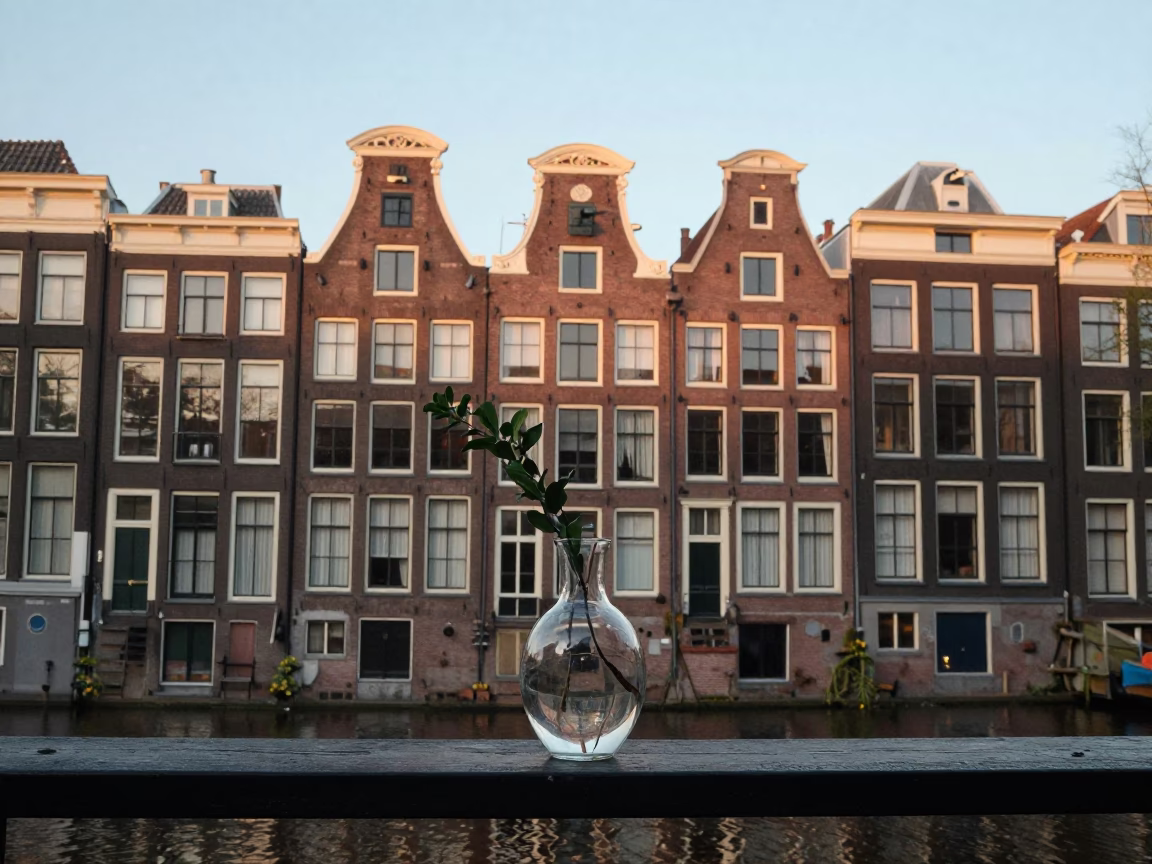 Amsterdam Canal House Facade at Dawn with Glass Vase and Letter Tray in in Amsterdam, Netherlands