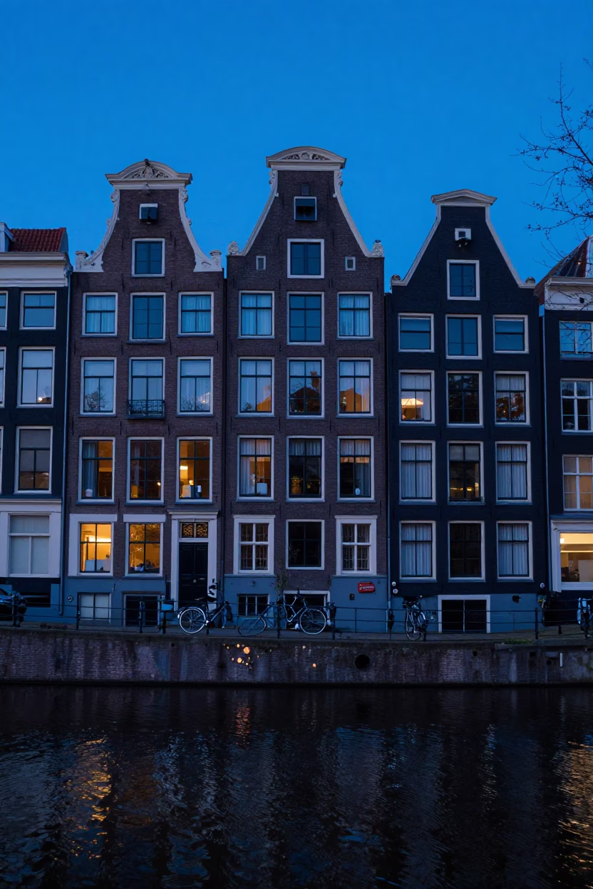Amsterdam Canal House Facade in Indigo Twilight with Bicycle and Condensation in in Amsterdam, Netherlands