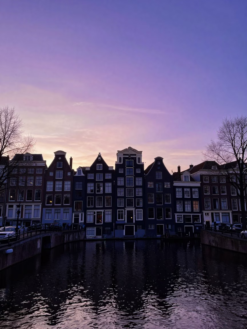 Amsterdam Canal Sunset Silhouette with Traditional House Facades and Historic Architecture in in Amsterdam, Netherlands