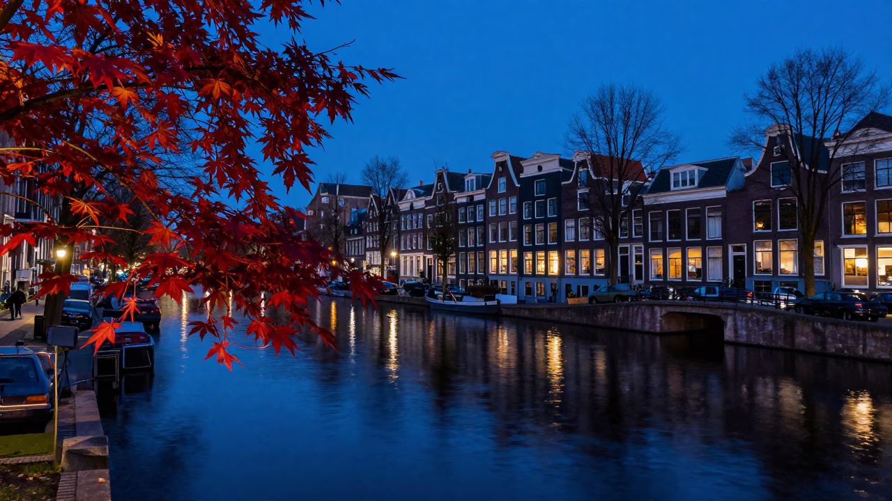 Amsterdam Canal Twilight Reflections with Japanese Maple and Traditional Brick Architecture in in Amsterdam, Netherlands