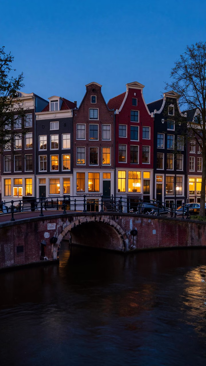 Amsterdam Canal Twilight Scene with Red Brick Facades and Wet Cobblestone Reflections in in Amsterdam, Netherlands