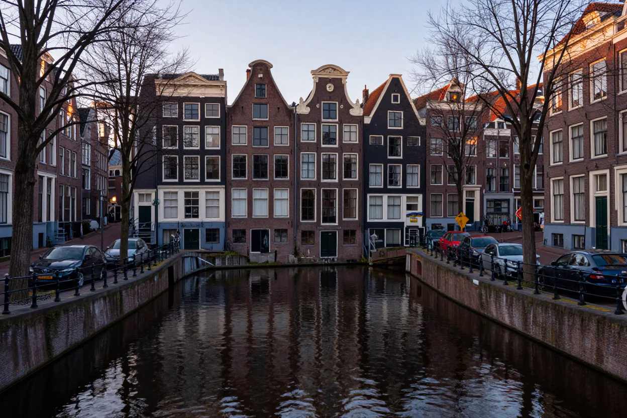 Amsterdam Canals at Dawn with Traditional Dutch Architecture and Morning Mist in in Amsterdam, Netherlands