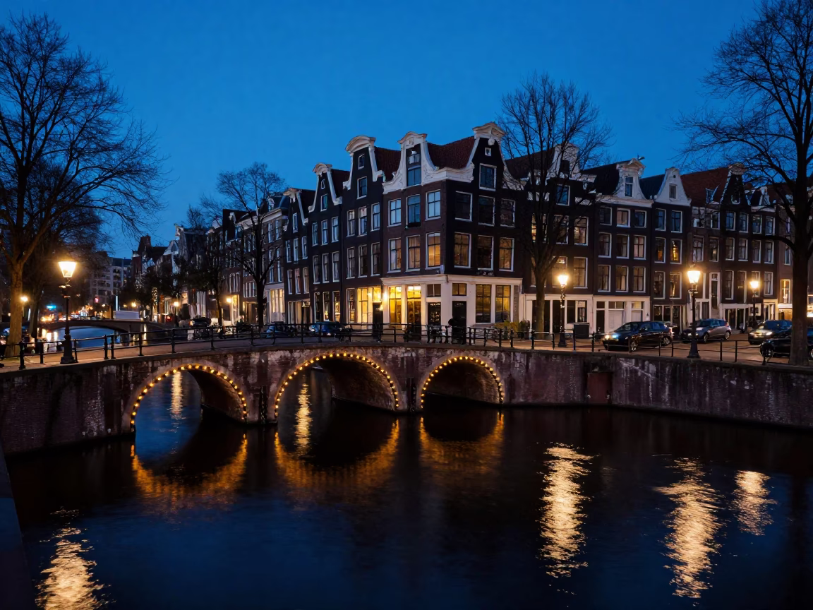 Amsterdam Evening Blue Hour Canal Bridge Scene with Vintage Bicycle and Cobblestone Street in in Amsterdam, Netherlands