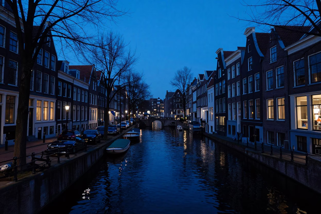 Amsterdam Evening Blue Hour Canal View with District Heating Pipes and Traditional Architecture in in Amsterdam, Netherlands