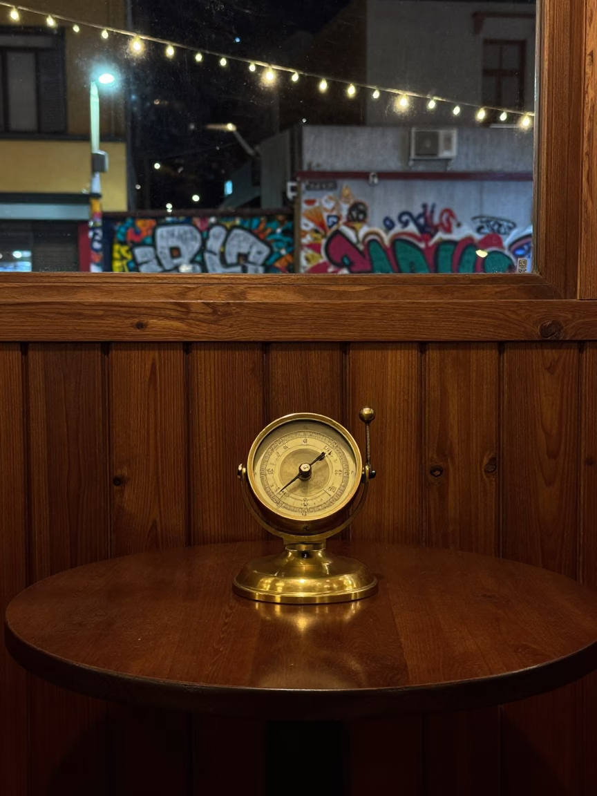 Antique Barometer on Cafe Table in on a cafe table by a window near Graffiti District, Bogota