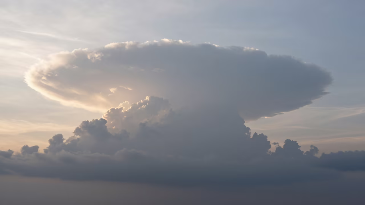 Anvil Cloud Silhouette Over The Hague in over a horizon of stacked thunderheads near The Hague