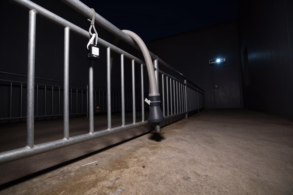 Aquarium Hose Hanger in Nighttime Kennel Corridor in in a boarding kennel corridor in Vehari