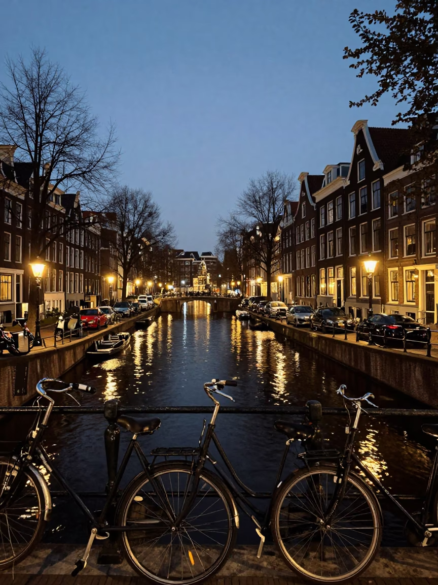 As City Lights Begin To Glow on Canal in Amsterdam in in Amsterdam, Netherlands