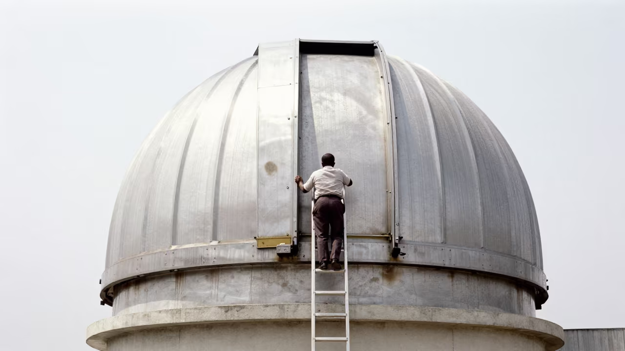 Astronomer Secures Observatory Latch on Windy Douala Platform in on a wind-scoured research platform in Douala