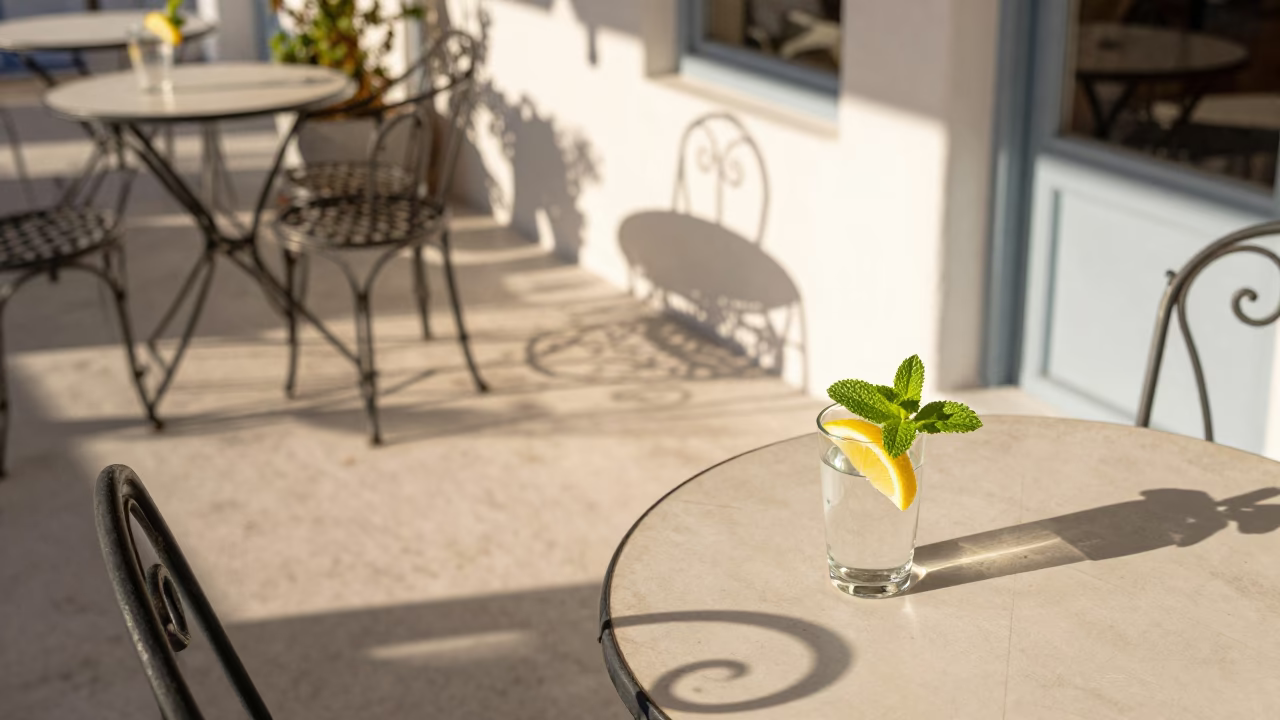 Athens Cafe Terrace Late Afternoon Scene With Herb And Drinking Vessel in in Athens, Greece