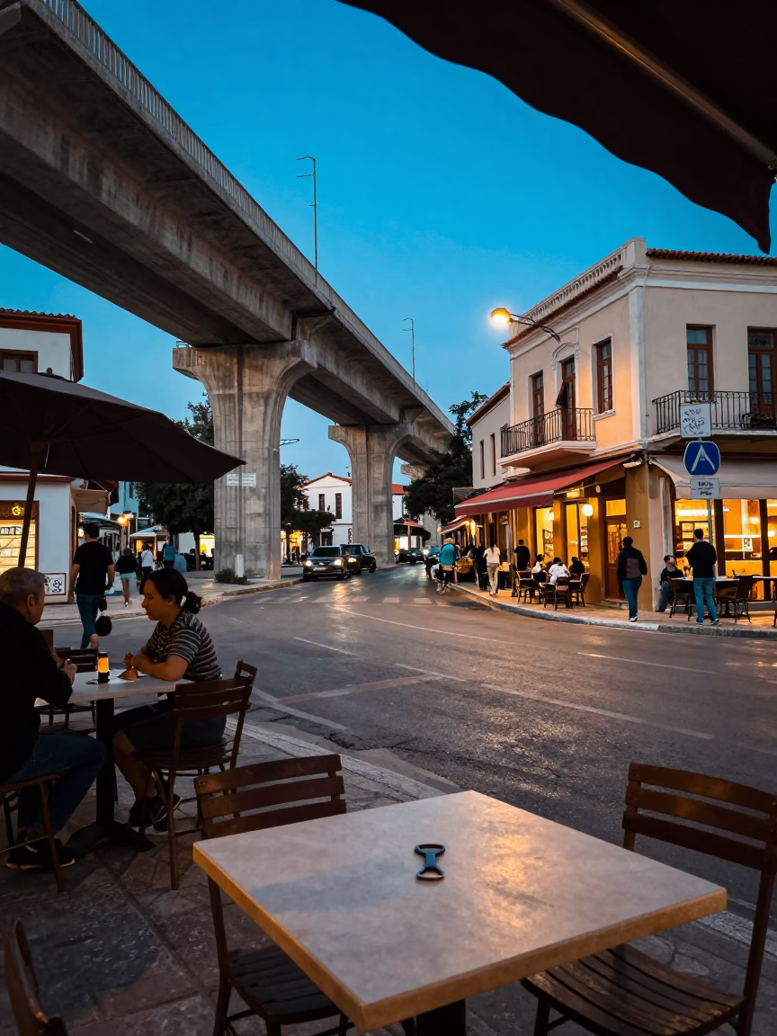 Athens Greece Evening Street Scene with Concrete Viaduct and Local Café Interaction in in Athens, Greece